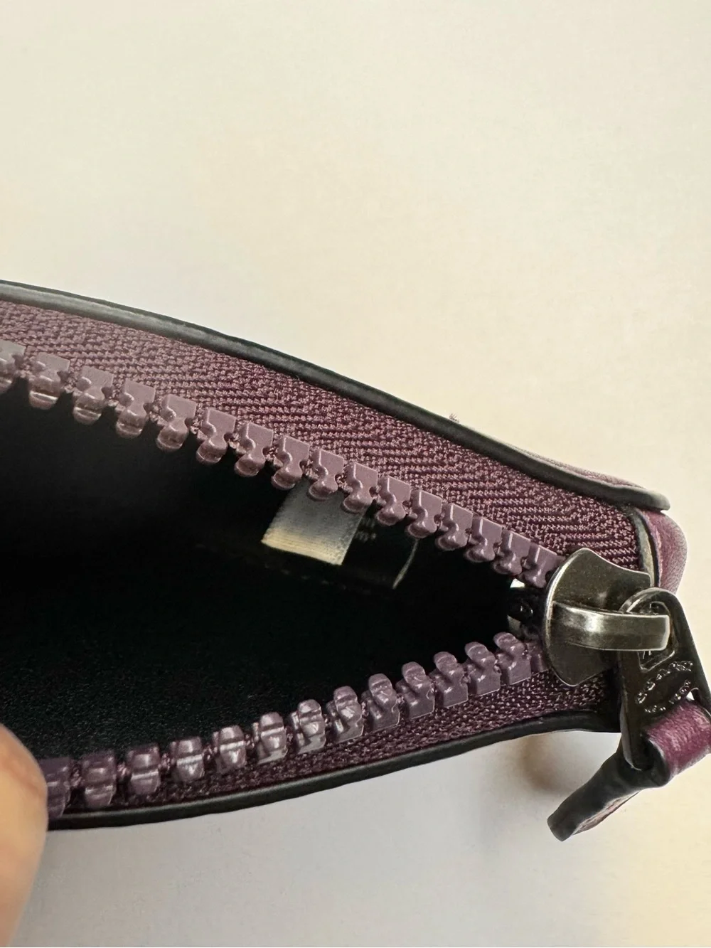 Coach compact triangular